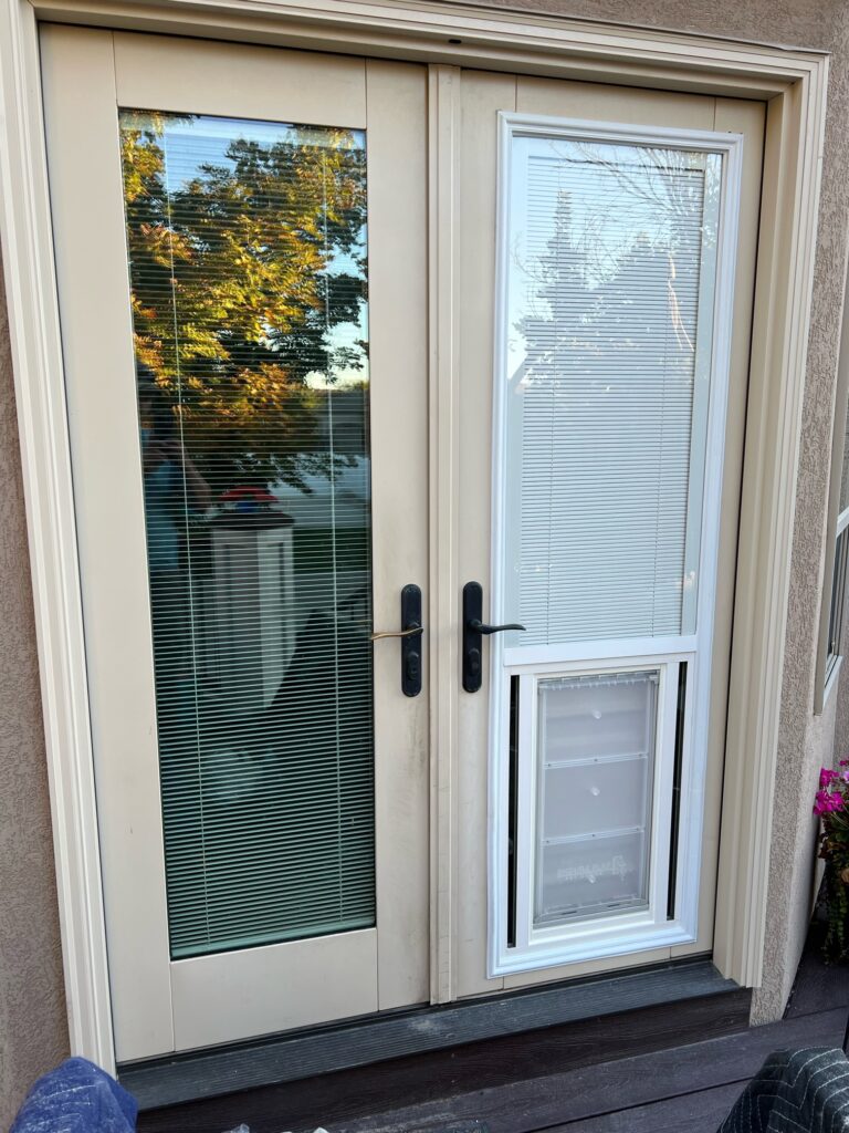 Full lite glass door with blinds and pet door